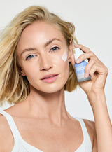 Trillion cellular activating resurfacing serum woman with product on her face